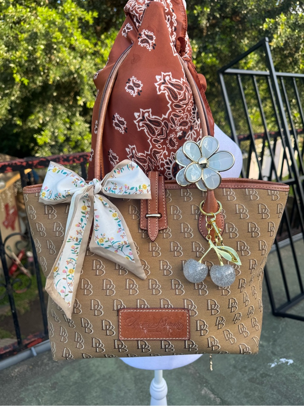 Dooney & Bourke Tan Logo Tote with Floral Charm and Bow